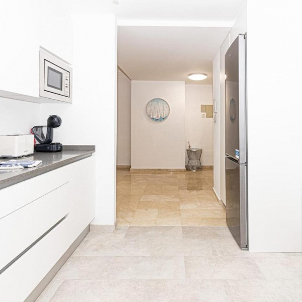 The kitchen, view into the living room